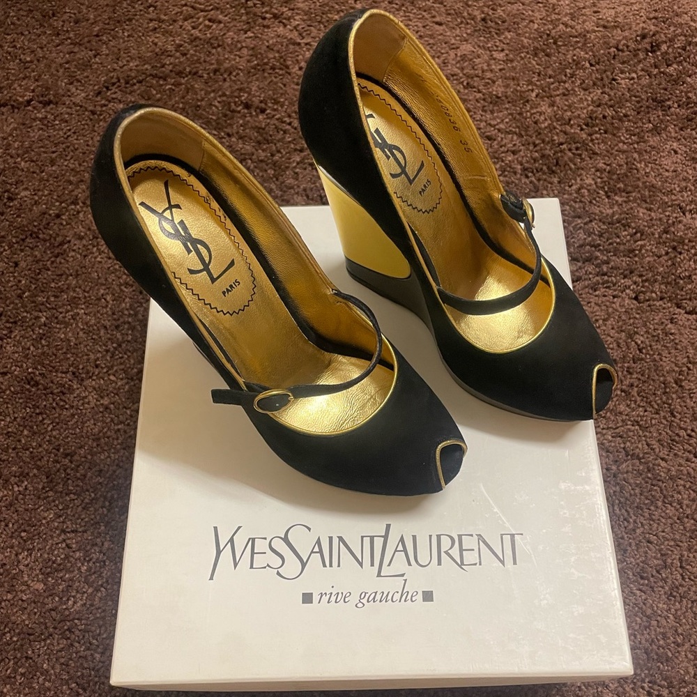 Beautiful YSL black wedges with gold trim. Gently worn in great condition!